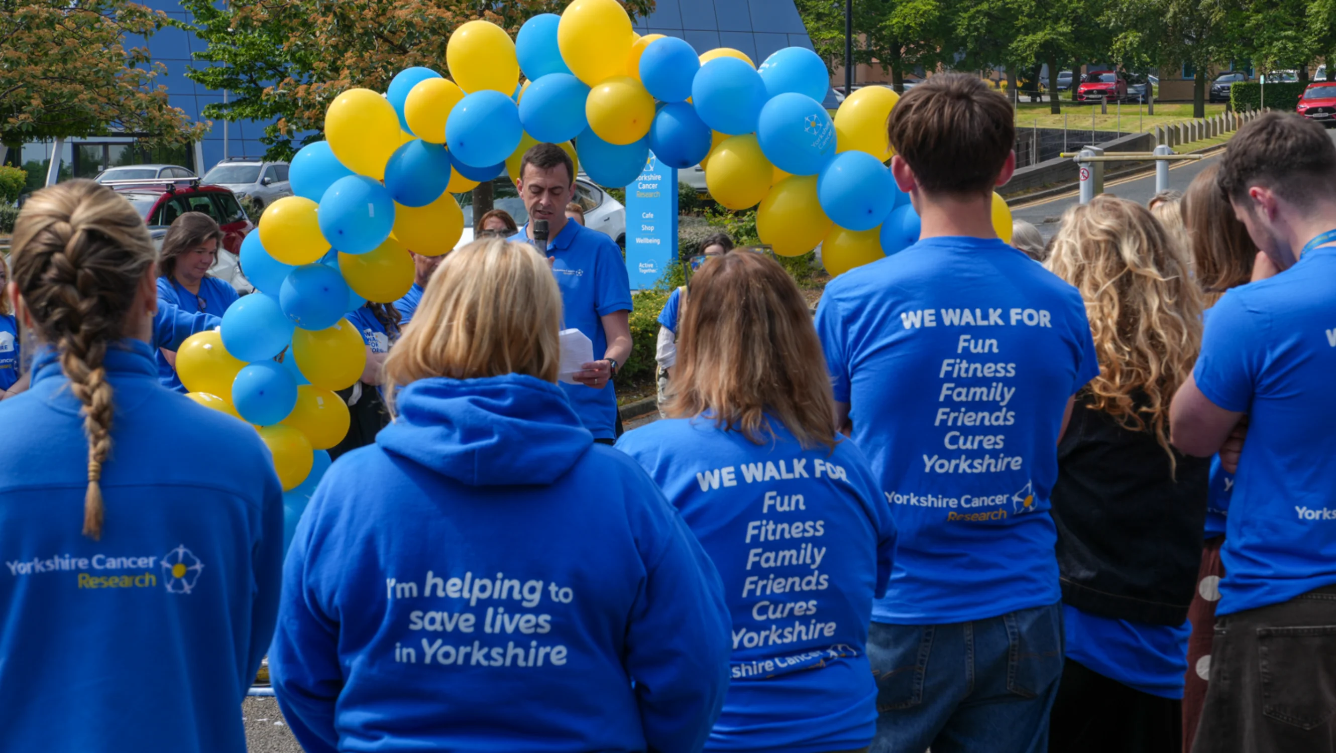 Employees at the Yorkshire Cancer Research Baton Relay finish line
