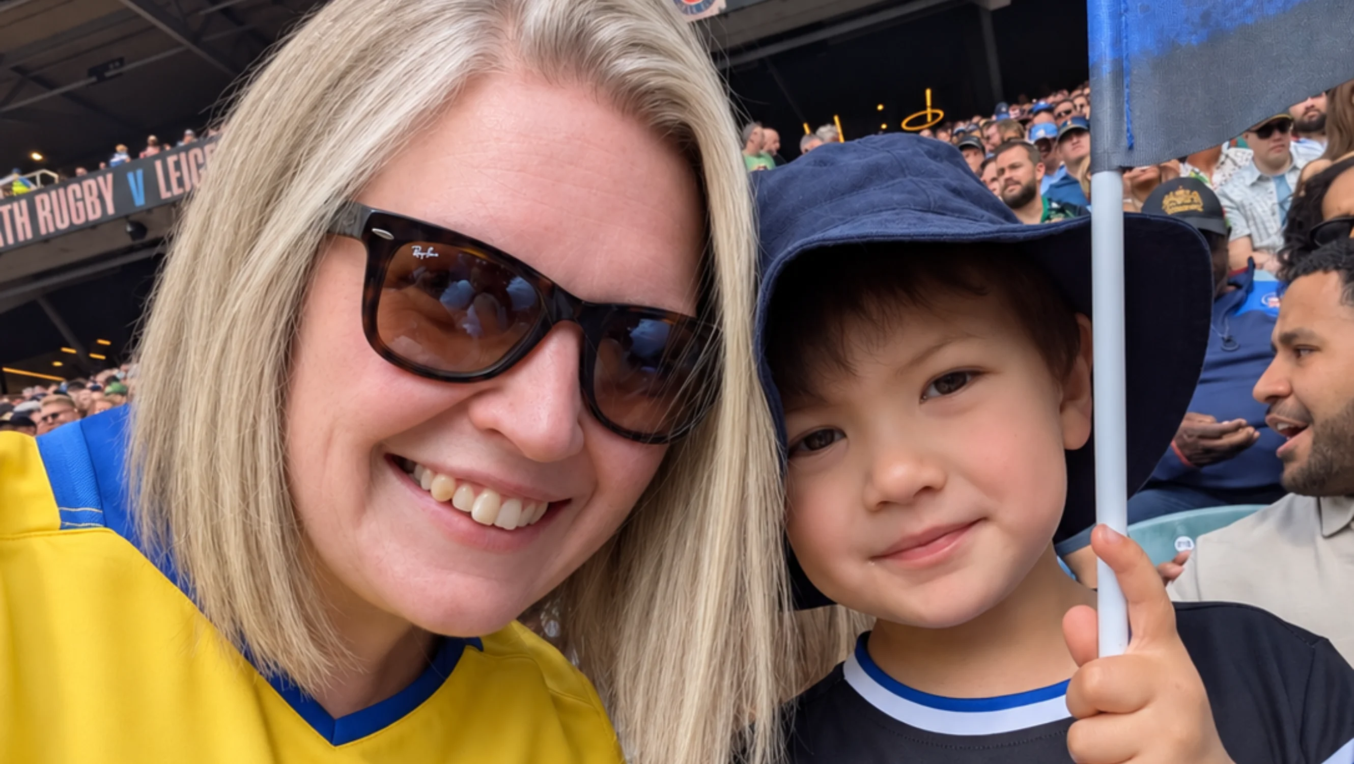Steph with her son at a sport game