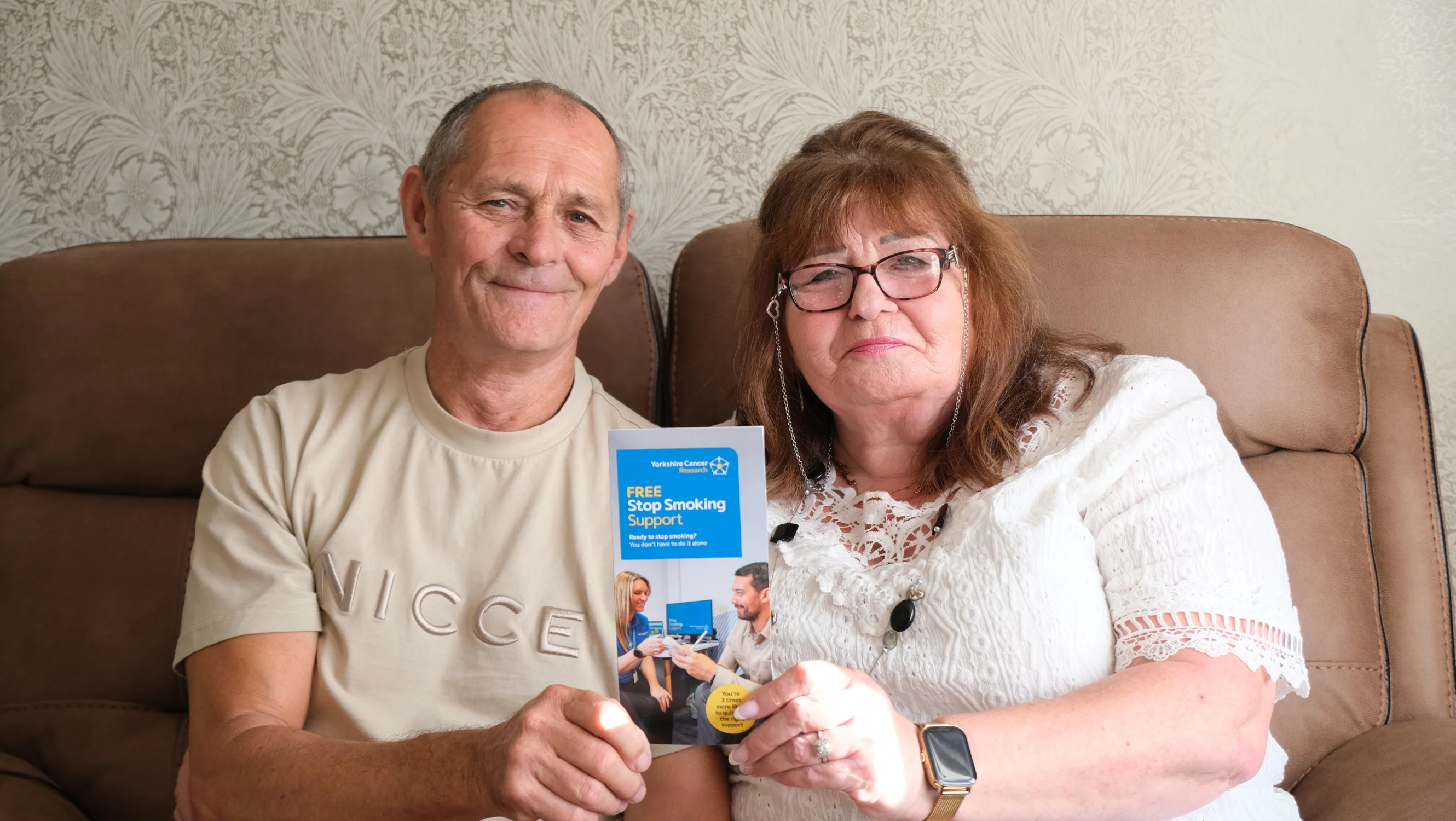 Linda and Terry holding a stop smoking support leaflet