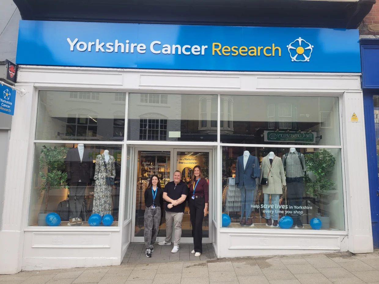 Employees in front of the Yorkshire Cancer Research Scarborough shop