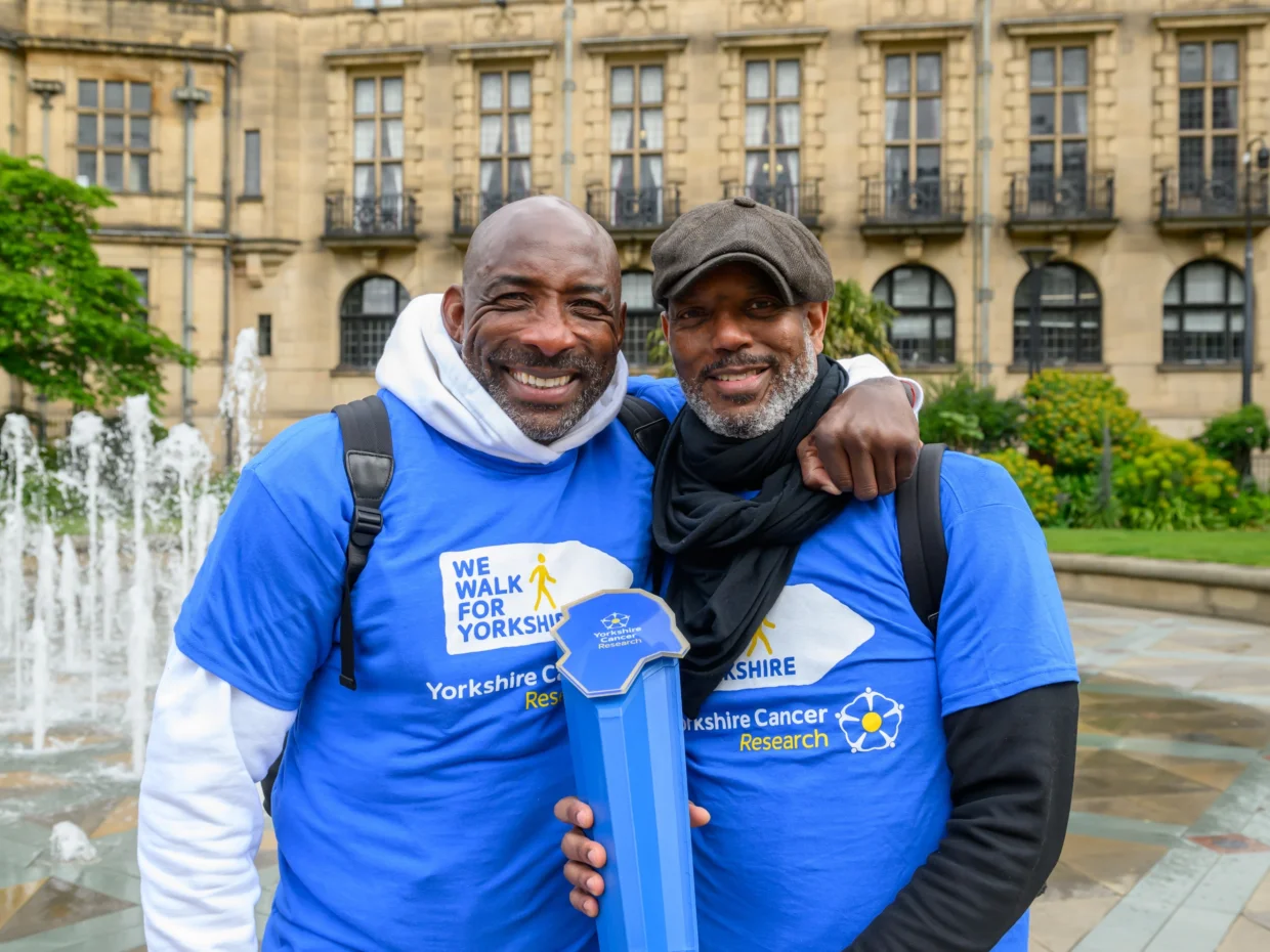 Johnny Nelson hugging his friend Aaron Casserly Stewart