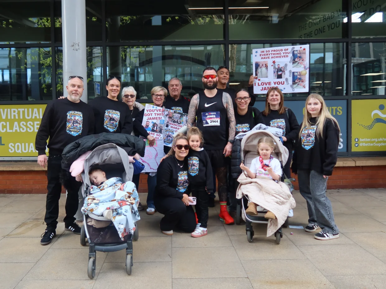 James with his family after completing the Manchester Marathon
