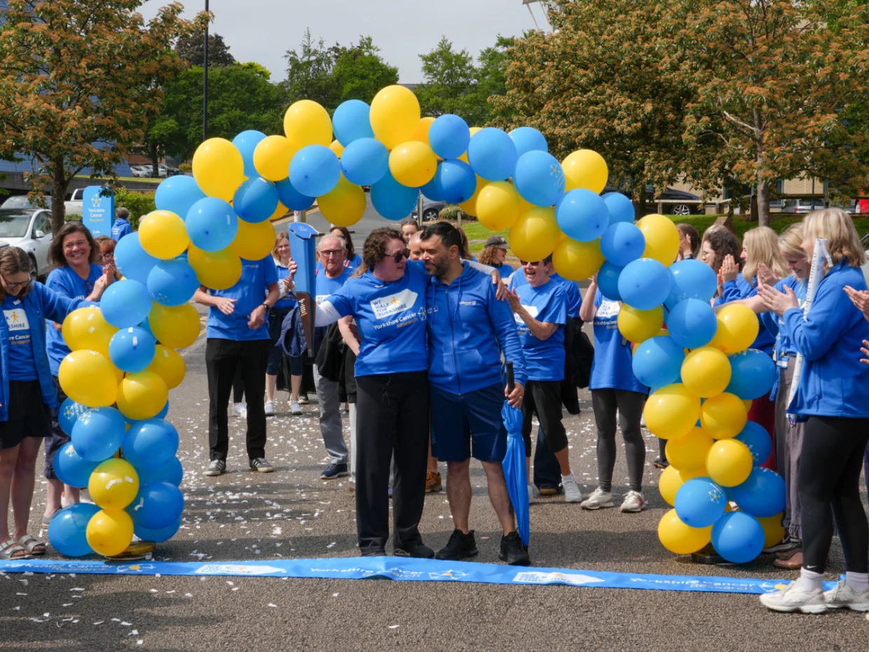 Katie and Andy crossing the finish line