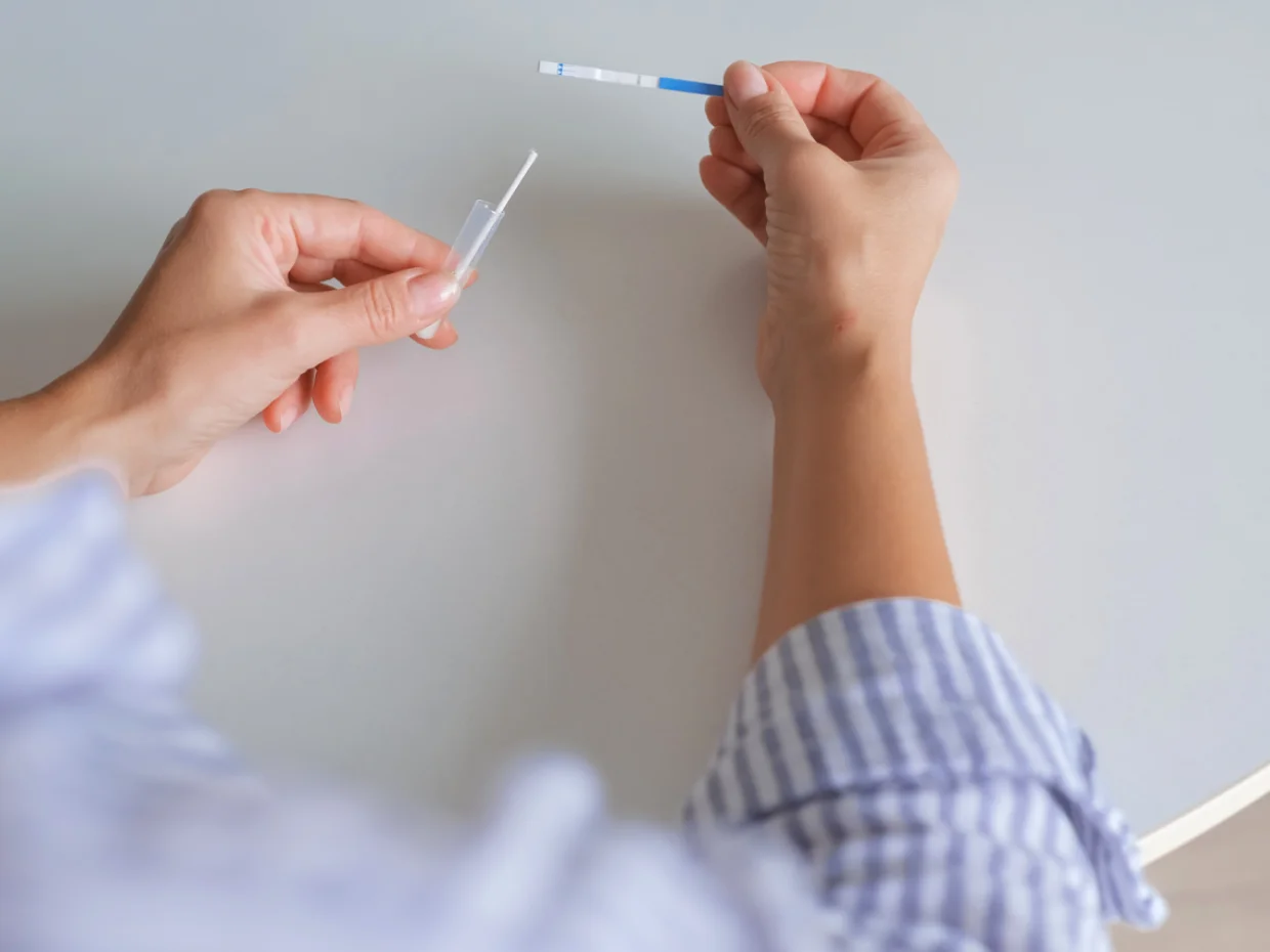 Two hands taking a swab test