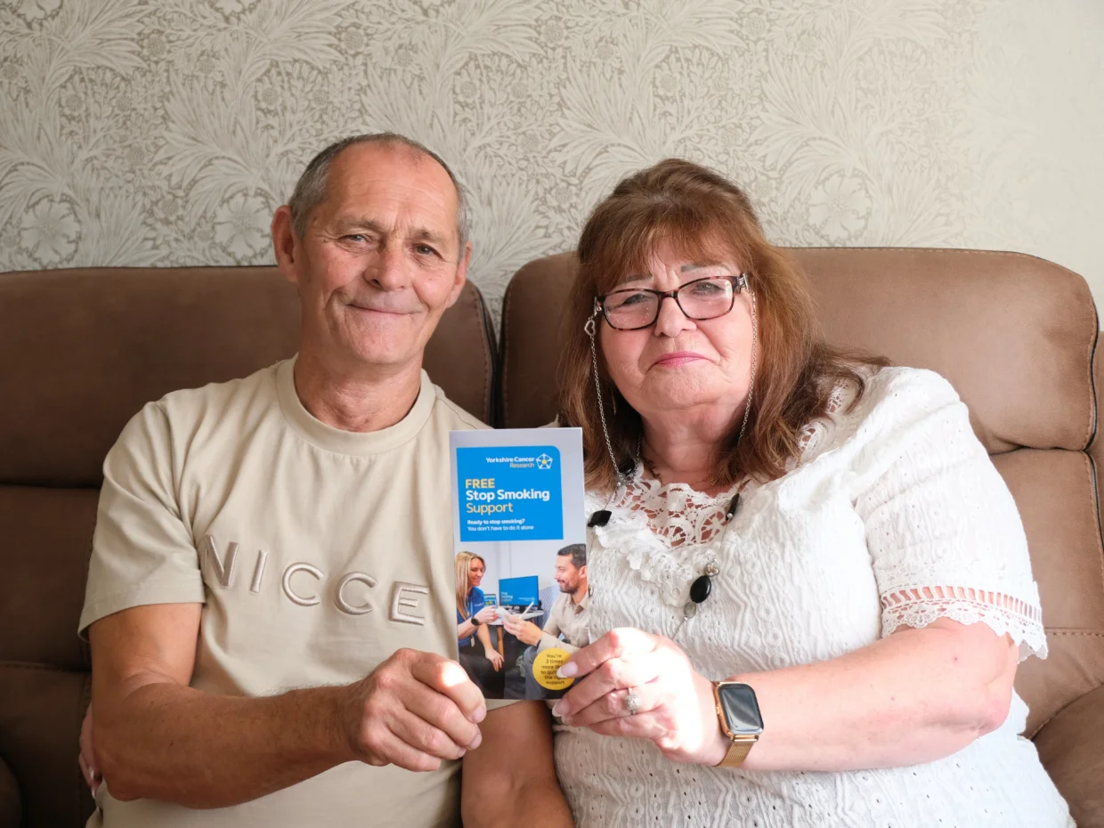 Linda and Terry holding a stop smoking support leaflet
